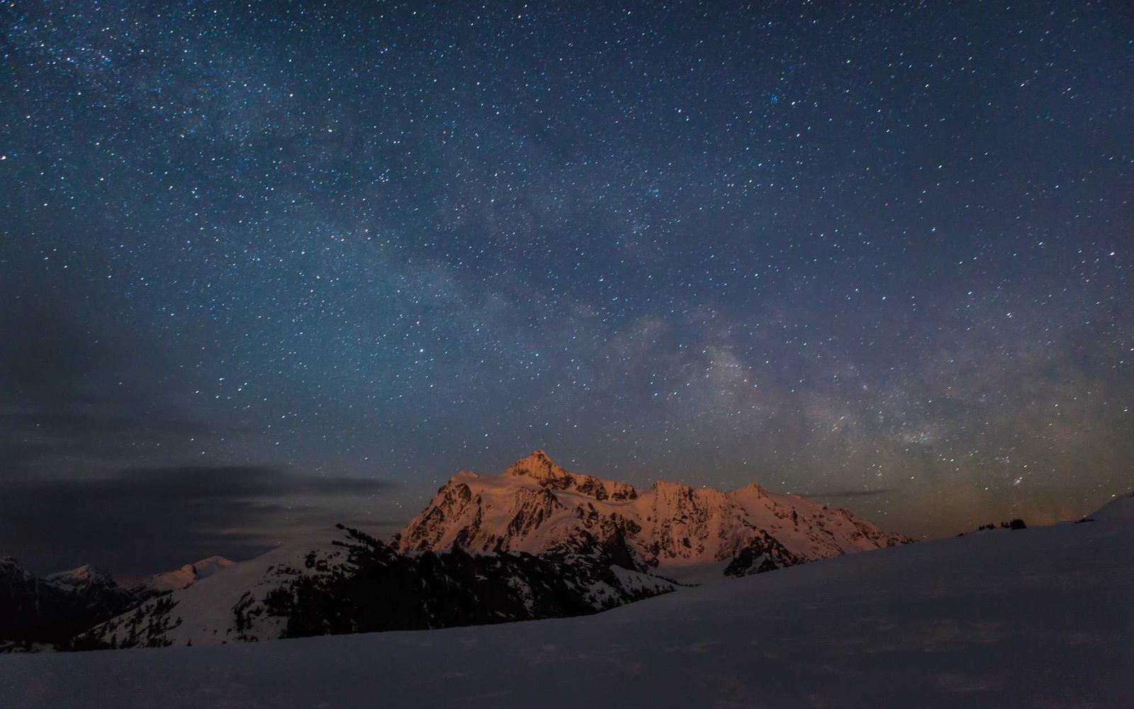 A solitary silhouette beneath an empty twilight sky